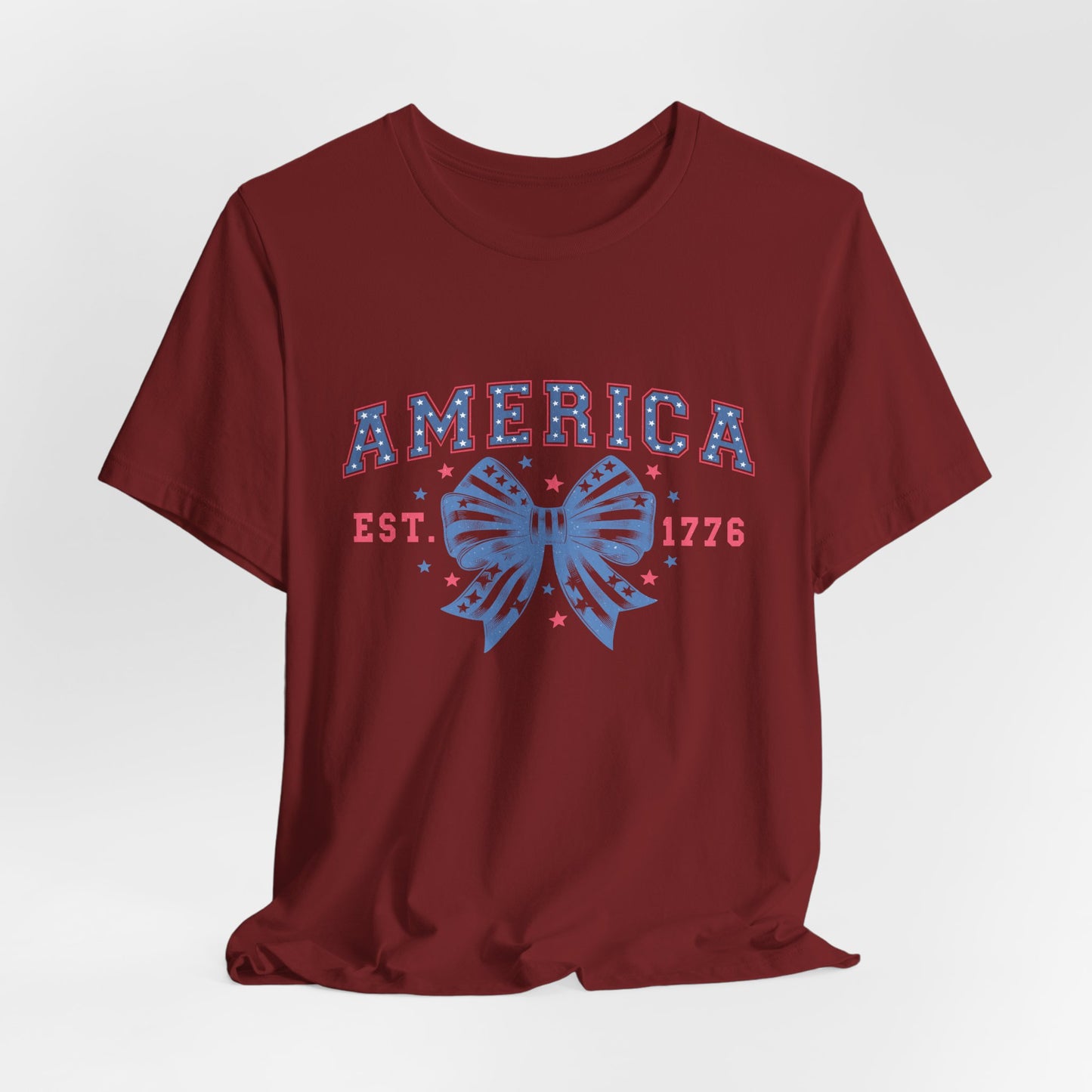 America Est. 1776 Patriotic T-Shirt – Stars & Stripes Bow Graphic