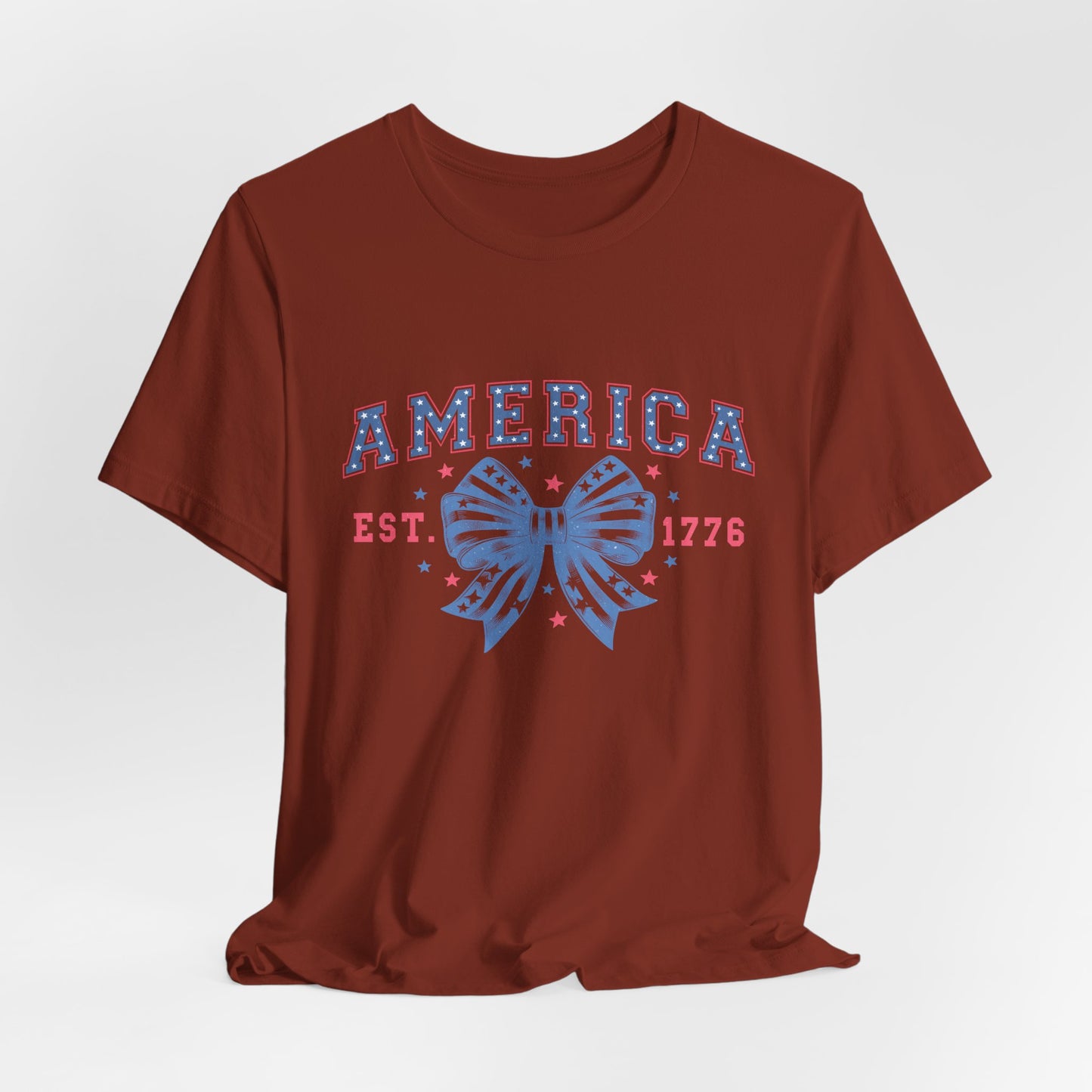 America Est. 1776 Patriotic T-Shirt – Stars & Stripes Bow Graphic