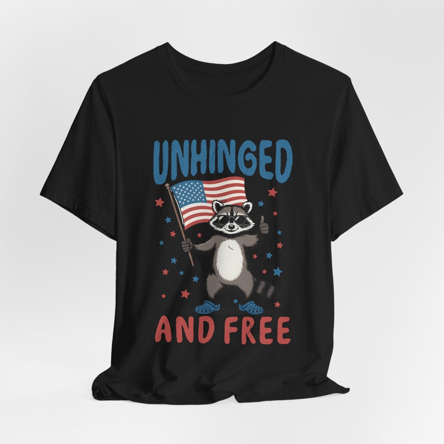 T‑Shirt — "Unhinged and Free" Raccoon American Flag Graphic Tee