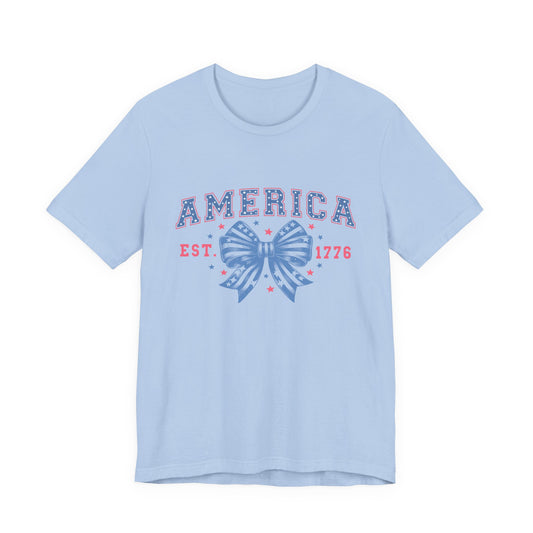 America Est. 1776 Patriotic T-Shirt – Stars & Stripes Bow Graphic