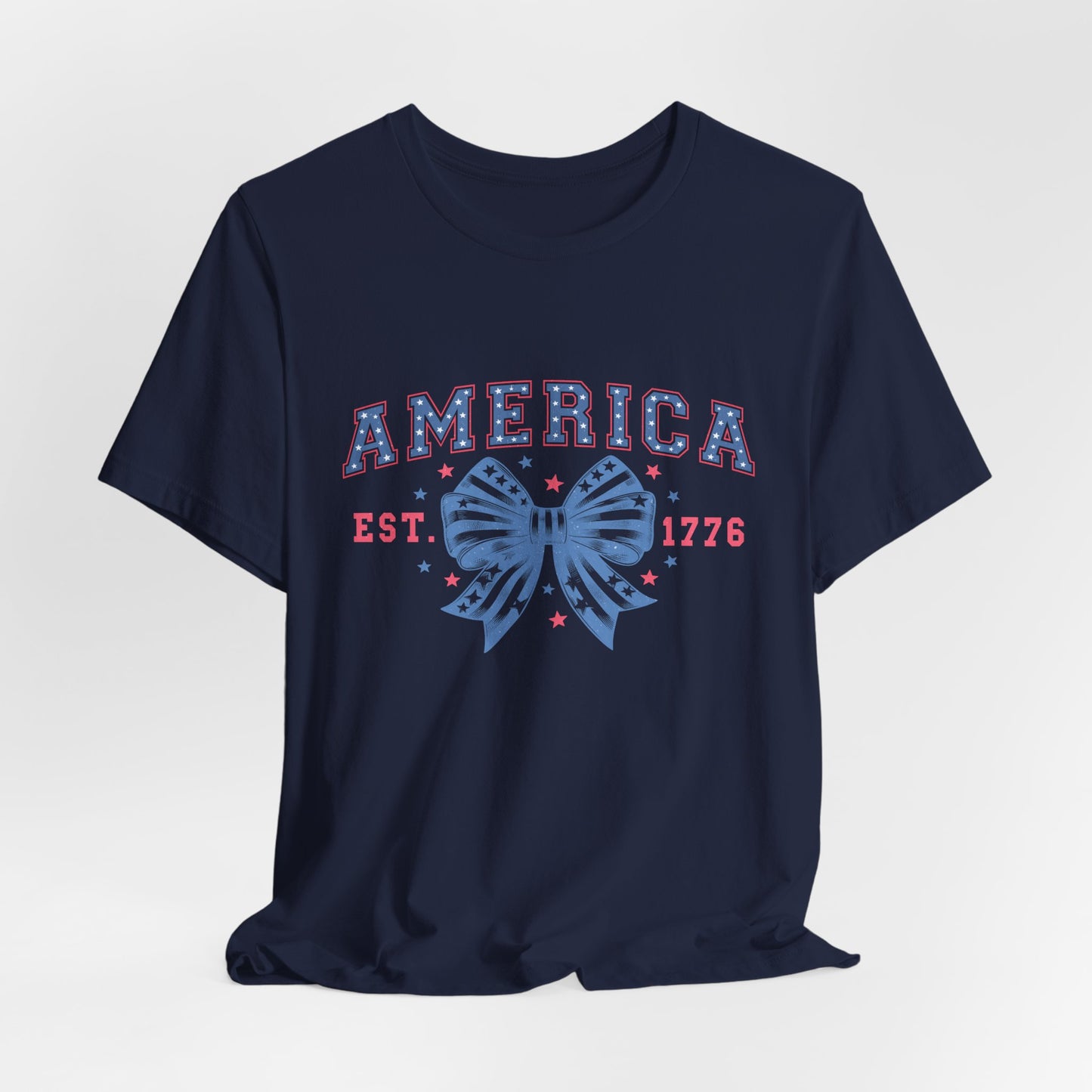 America Est. 1776 Patriotic T-Shirt – Stars & Stripes Bow Graphic