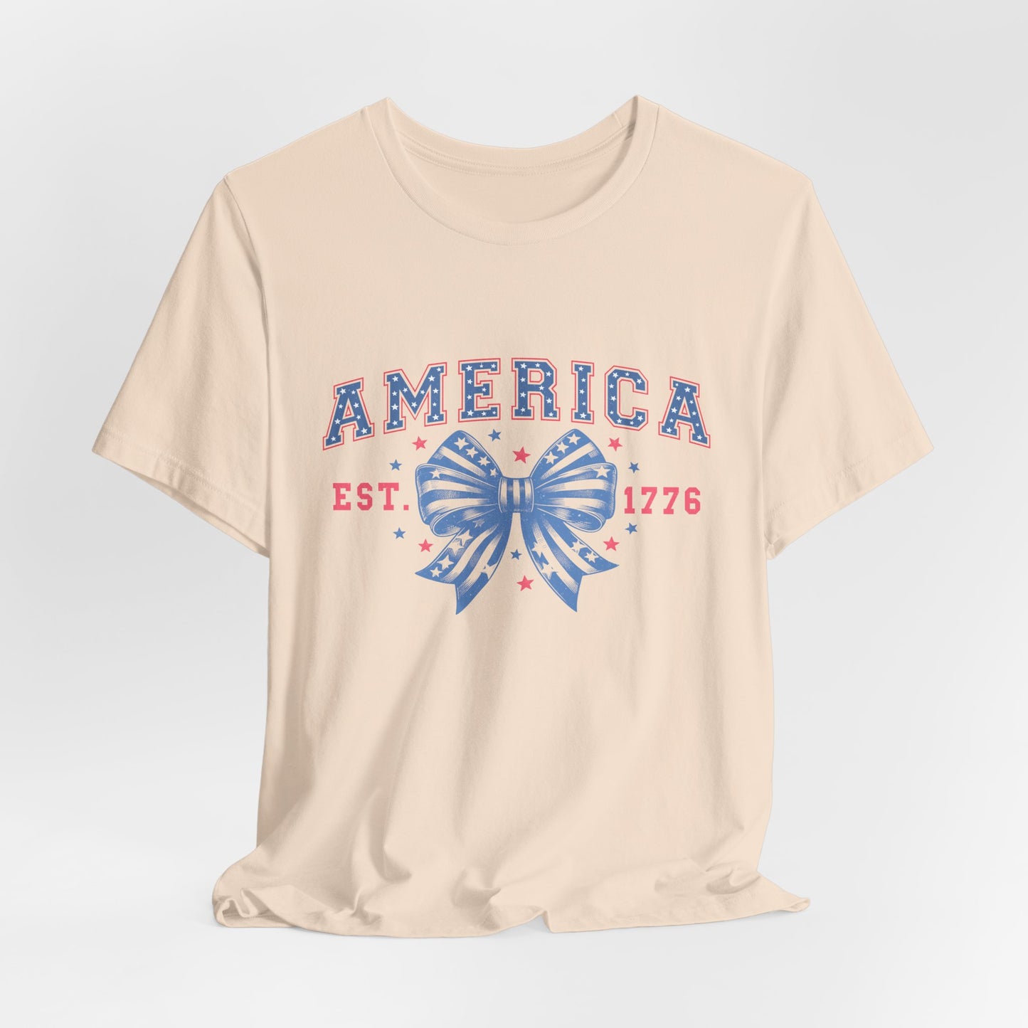 America Est. 1776 Patriotic T-Shirt – Stars & Stripes Bow Graphic