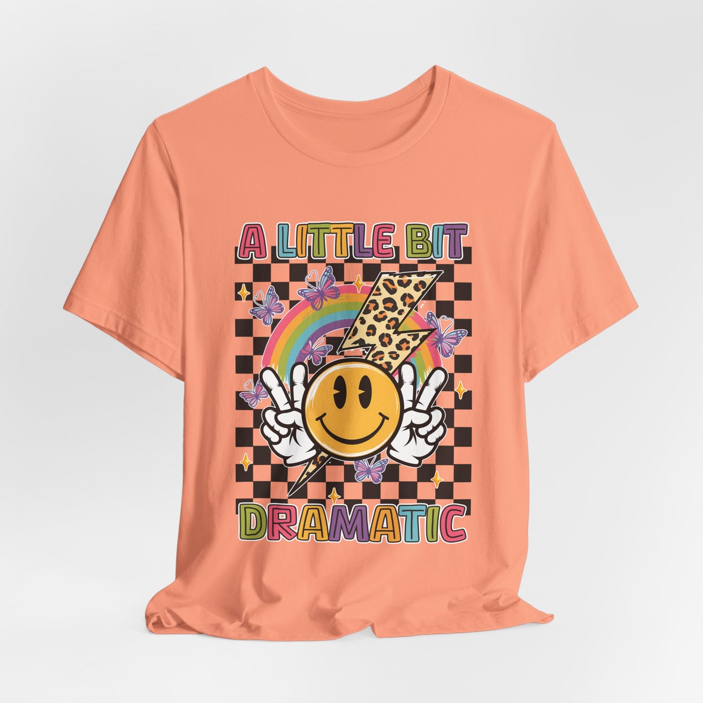 A Little Bit Dramatic Graphic Tee — Smiley Rainbow Checkerboard T-Shirt