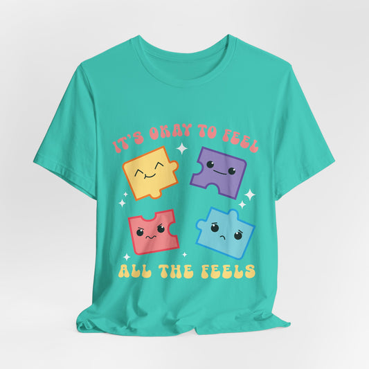 “It’s Okay to Feel” Puzzle Pieces Tee — Mental Health Awareness Comfort Shirt