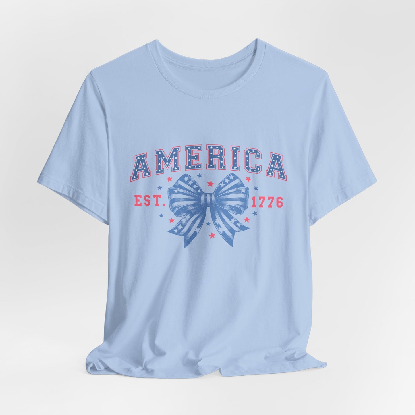America Est. 1776 Patriotic T-Shirt – Stars & Stripes Bow Graphic